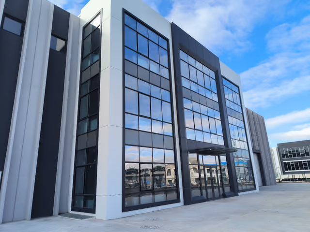 Erkonsan Factory: Glass facade and main entrance detail