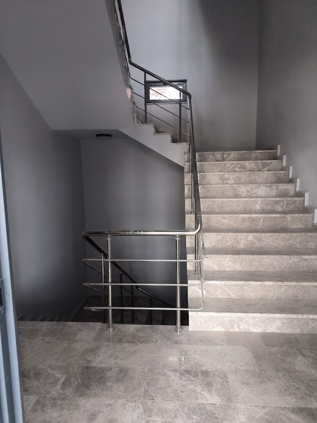 Erkonsan Factory: Marble staircase and stainless-steel balustrade detail